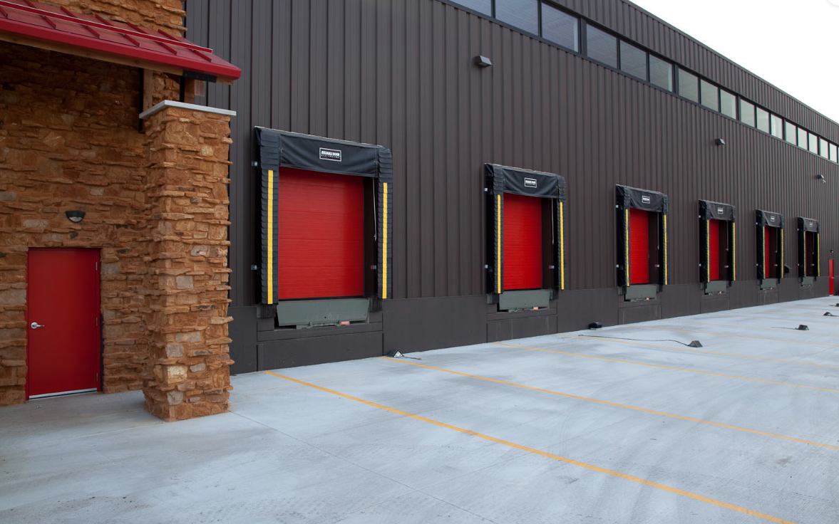 Modern commercial garage door with sleek metal finish, showcasing durability and professional industrial design
