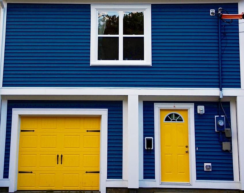 Emergency garage door repair service technician replacing hardware parts in Hebron Ohio